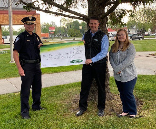 Indianola Country Financial presents Helping Heroes check
